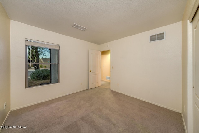 interior space featuring a textured ceiling