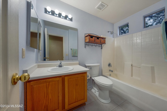 full bathroom featuring tile patterned flooring, vanity, toilet, and washtub / shower combination