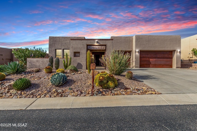 adobe home featuring a garage