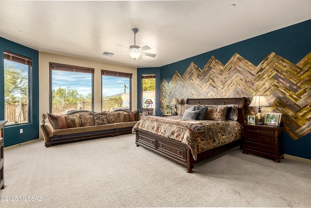 carpeted bedroom with ceiling fan