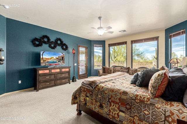 bedroom with ceiling fan and carpet floors