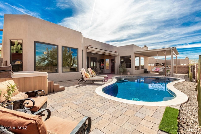 view of pool featuring a hot tub, a pergola, and a patio area