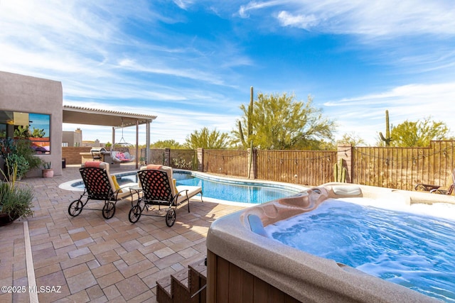 view of pool featuring a pergola, a hot tub, and a patio