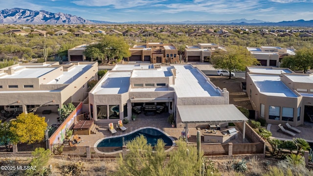 birds eye view of property featuring a mountain view