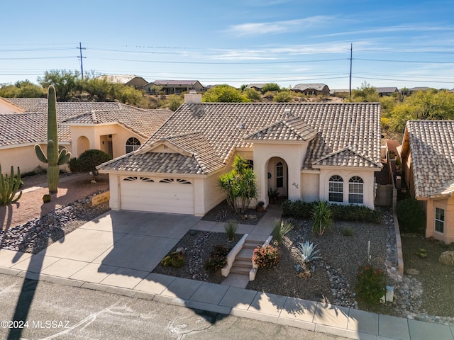 view of front of property with a garage