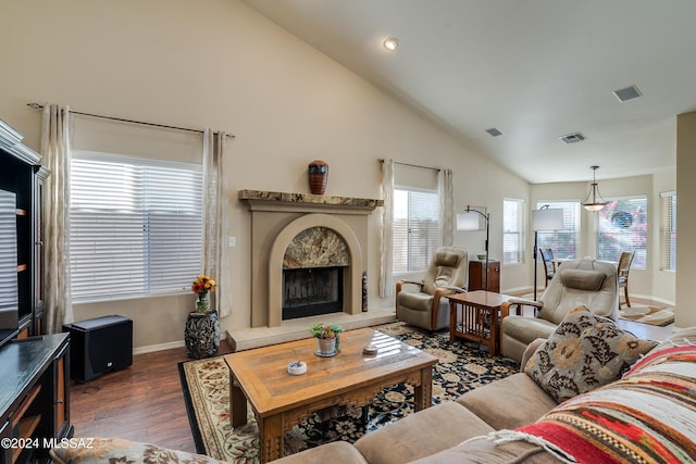 living room featuring high vaulted ceiling and dark hardwood / wood-style floors