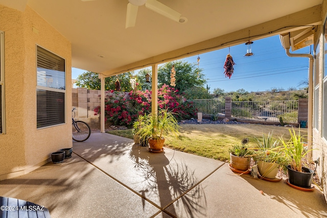 view of patio featuring ceiling fan