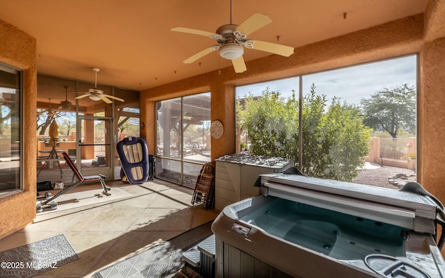 sunroom / solarium featuring a hot tub