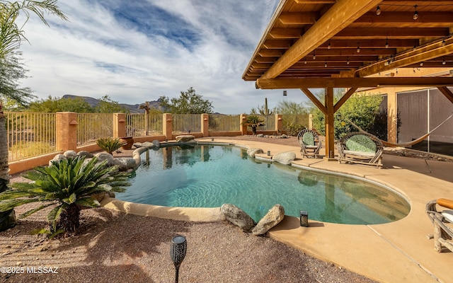 view of swimming pool featuring a fenced backyard, a fenced in pool, and a patio