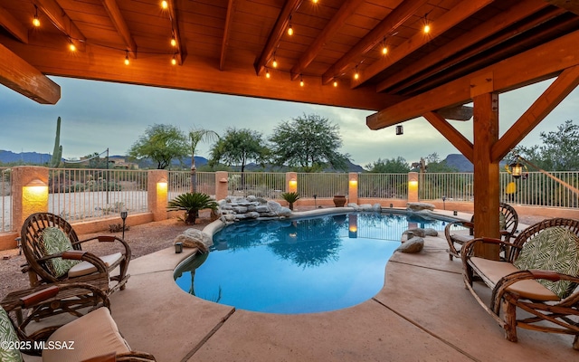 view of swimming pool featuring a patio, a fenced backyard, and a fenced in pool