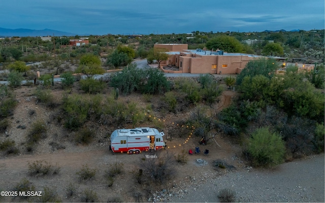 drone / aerial view featuring a mountain view