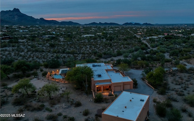 birds eye view of property with a mountain view