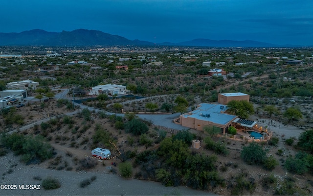 birds eye view of property featuring a mountain view