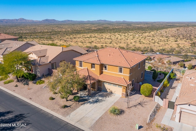 drone / aerial view featuring a mountain view