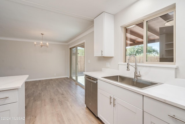 kitchen featuring pendant lighting, white cabinetry, dishwasher, sink, and light hardwood / wood-style floors