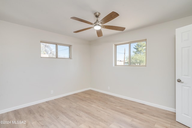 unfurnished room featuring ceiling fan and light hardwood / wood-style floors