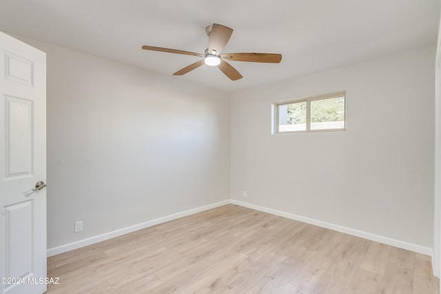 unfurnished room featuring ceiling fan and light wood-type flooring