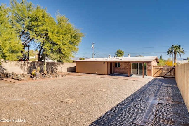 back of house with a patio