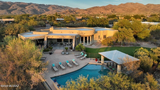 exterior space with a patio area and a mountain view