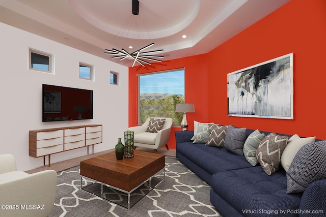 living area featuring recessed lighting, a raised ceiling, and carpet floors