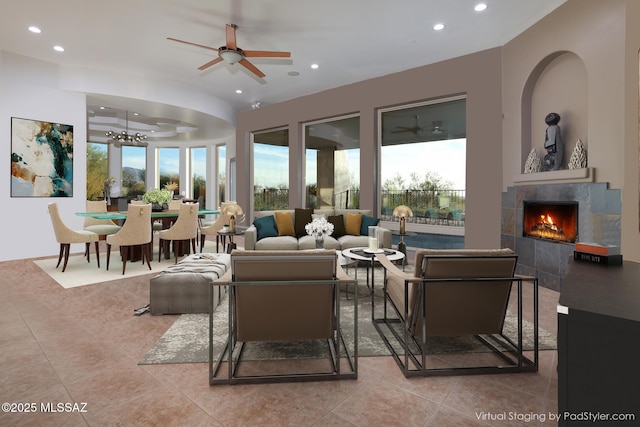 living room with a tiled fireplace, recessed lighting, tile patterned floors, and ceiling fan