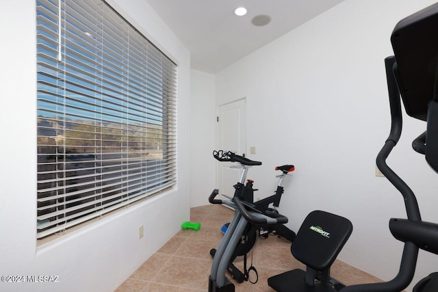 exercise room featuring light tile patterned flooring