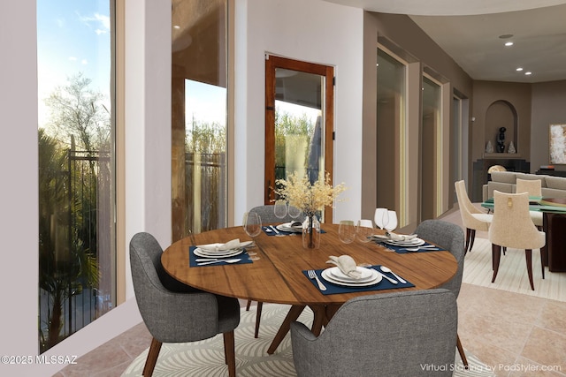 dining space with recessed lighting and tile patterned floors