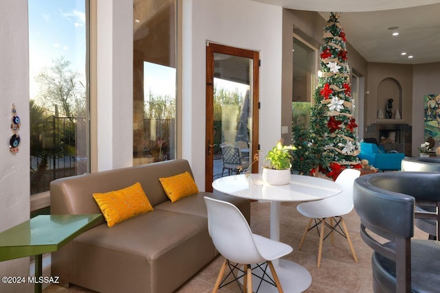 tiled dining space featuring a fireplace