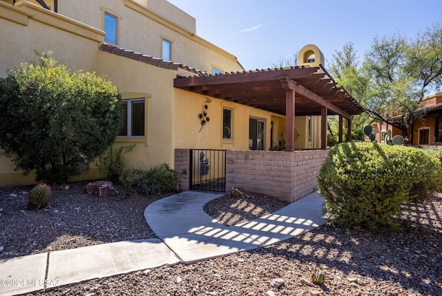 exterior space featuring a pergola