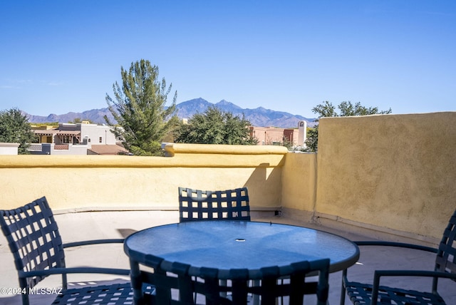 view of patio / terrace featuring a mountain view