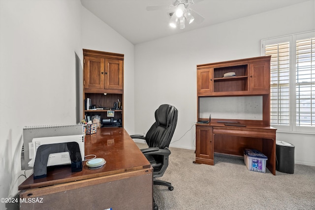 carpeted office with ceiling fan and vaulted ceiling