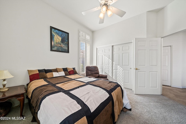 bedroom featuring ceiling fan, a closet, and carpet floors