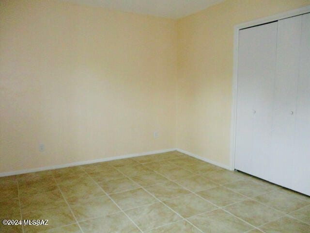 unfurnished room featuring tile patterned floors