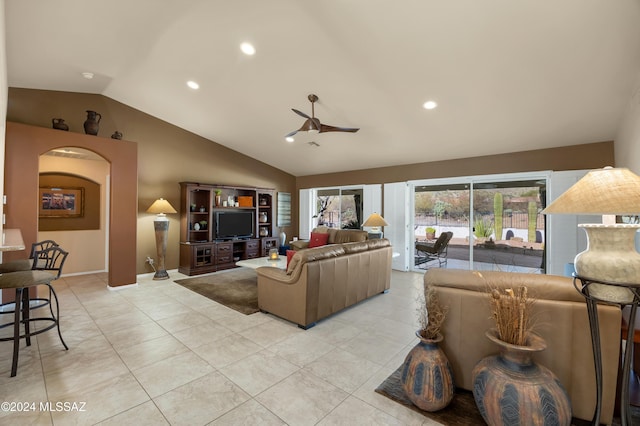 living room with light tile patterned floors, ceiling fan, and lofted ceiling