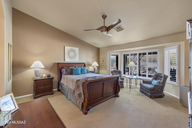 bedroom with multiple windows, ceiling fan, light carpet, and lofted ceiling