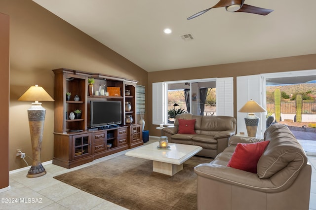 living room featuring ceiling fan, light tile patterned floors, and vaulted ceiling