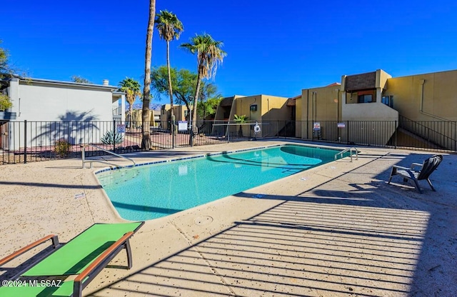 view of swimming pool featuring a patio area