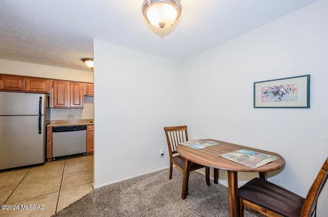 dining space with light colored carpet