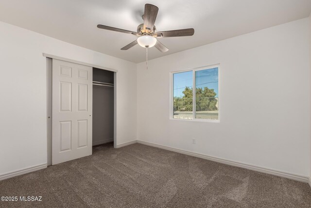 unfurnished bedroom featuring baseboards, carpet flooring, a closet, and ceiling fan