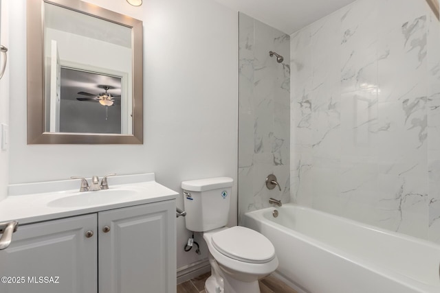 bathroom with shower / bath combination, a ceiling fan, vanity, and toilet