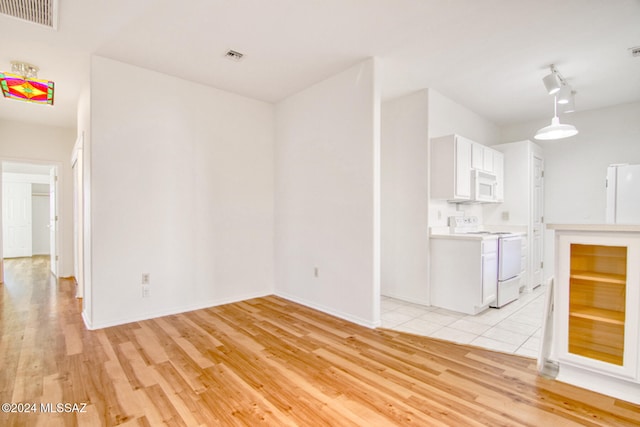 interior space featuring light hardwood / wood-style floors and track lighting