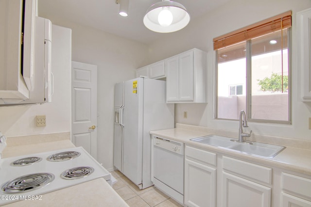 kitchen with white cabinets, light tile patterned floors, white appliances, and sink