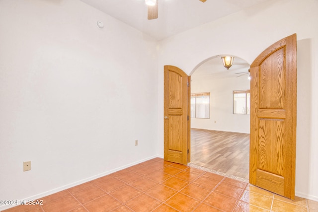 unfurnished room featuring ceiling fan and light hardwood / wood-style flooring