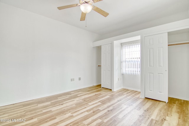 unfurnished bedroom featuring ceiling fan, a closet, and light hardwood / wood-style flooring