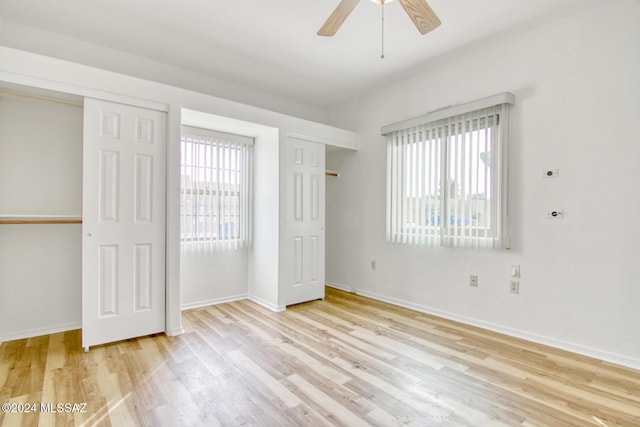 unfurnished bedroom featuring light wood-type flooring and ceiling fan