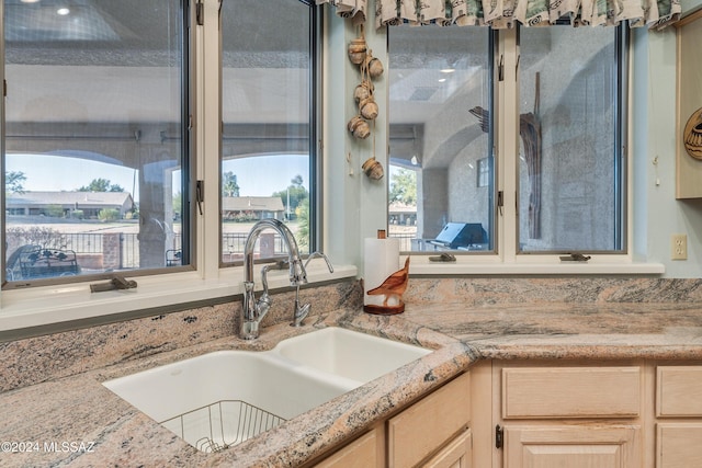 kitchen with light brown cabinets and sink