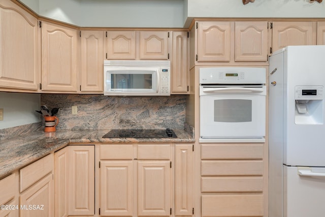 kitchen featuring light brown cabinets, white appliances, and backsplash