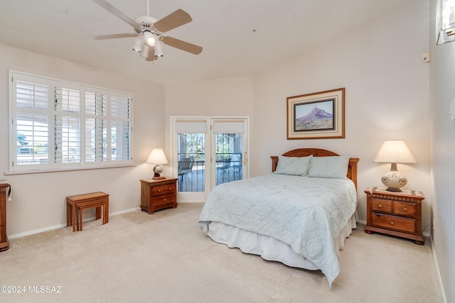 carpeted bedroom featuring access to exterior and ceiling fan