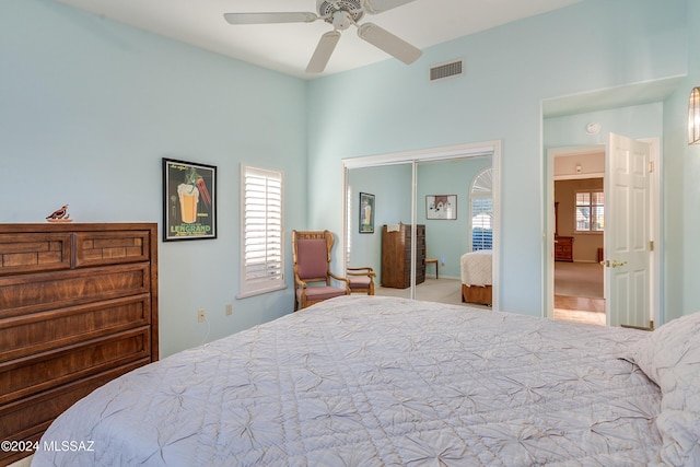 bedroom with ceiling fan and a closet