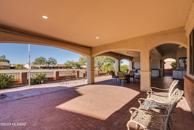 view of patio featuring ceiling fan